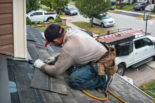 Professional Emergency Roof Repair technician working in La Porte City, IA